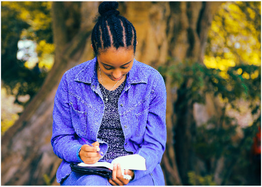 A young lady reading the Bible